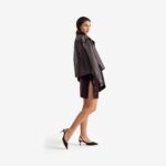 Caterpillar Coat Dark brown - This oversized leather coat draws on military-inspired design, with a large front pocket and structured lines that exude both authority and style.