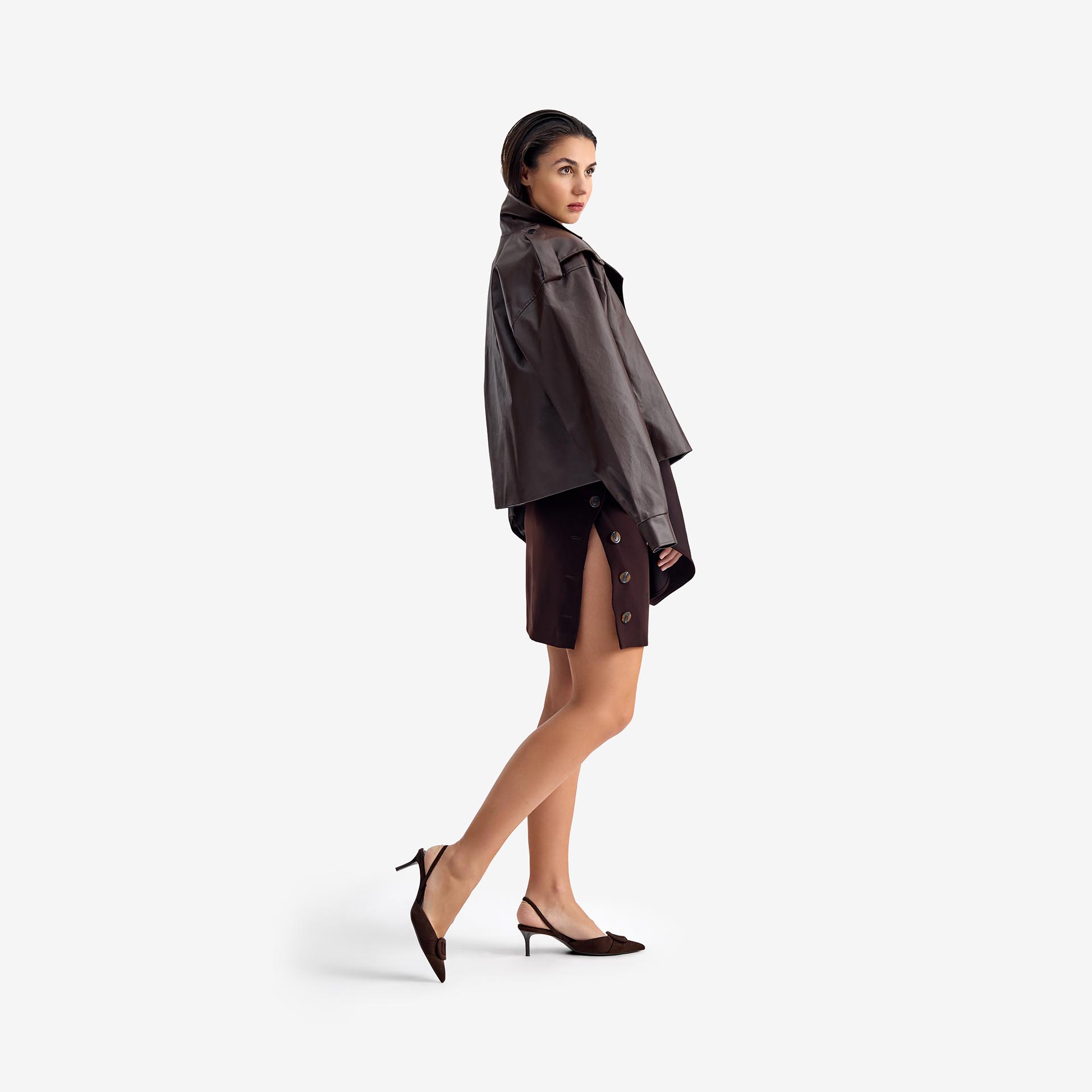 Caterpillar Coat Dark brown - This oversized leather coat draws on military-inspired design, with a large front pocket and structured lines that exude both authority and style.