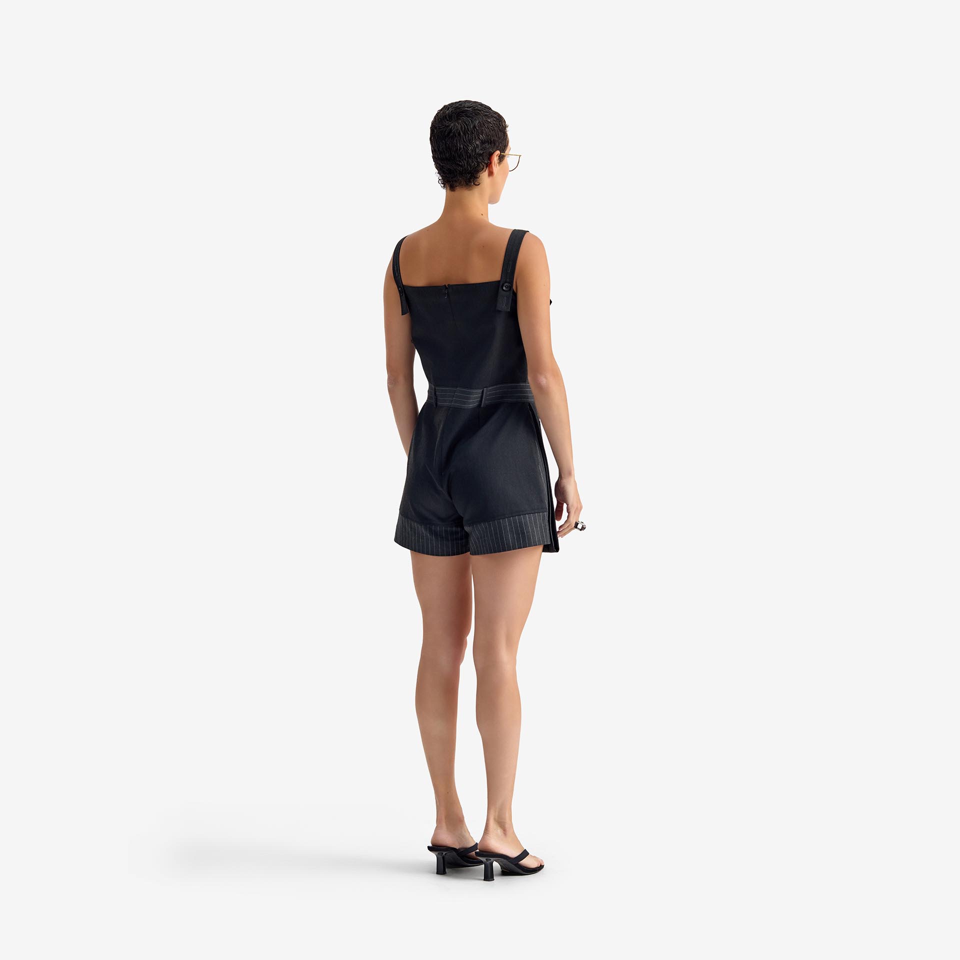 Caterpillar Jumpsuit Dark gray - This short, straight-cut jumpsuit combines clean lines with bold proportions.