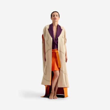 Caterpillar Kimono Jacket - This long orange linen kimono combines tradition and elegance with a lightweight, breathable fabric. Hand-embroidered details add an artisanal touch, making each piece unique.