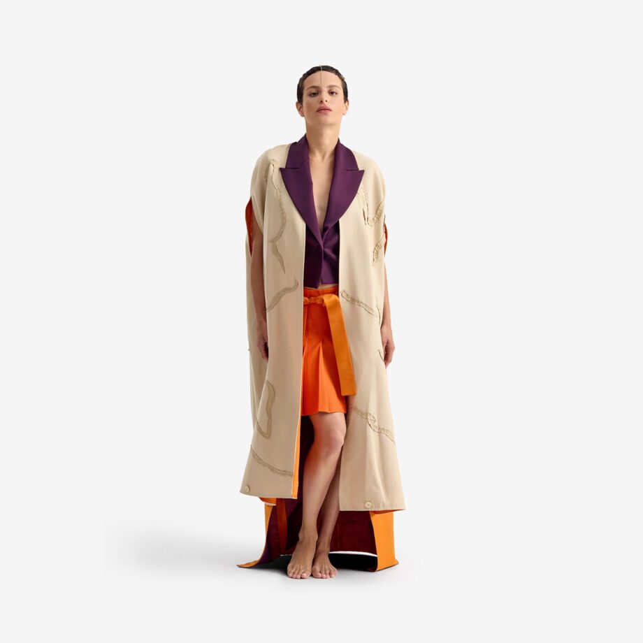Caterpillar Kimono Jacket - This long orange linen kimono combines tradition and elegance with a lightweight, breathable fabric. Hand-embroidered details add an artisanal touch, making each piece unique.