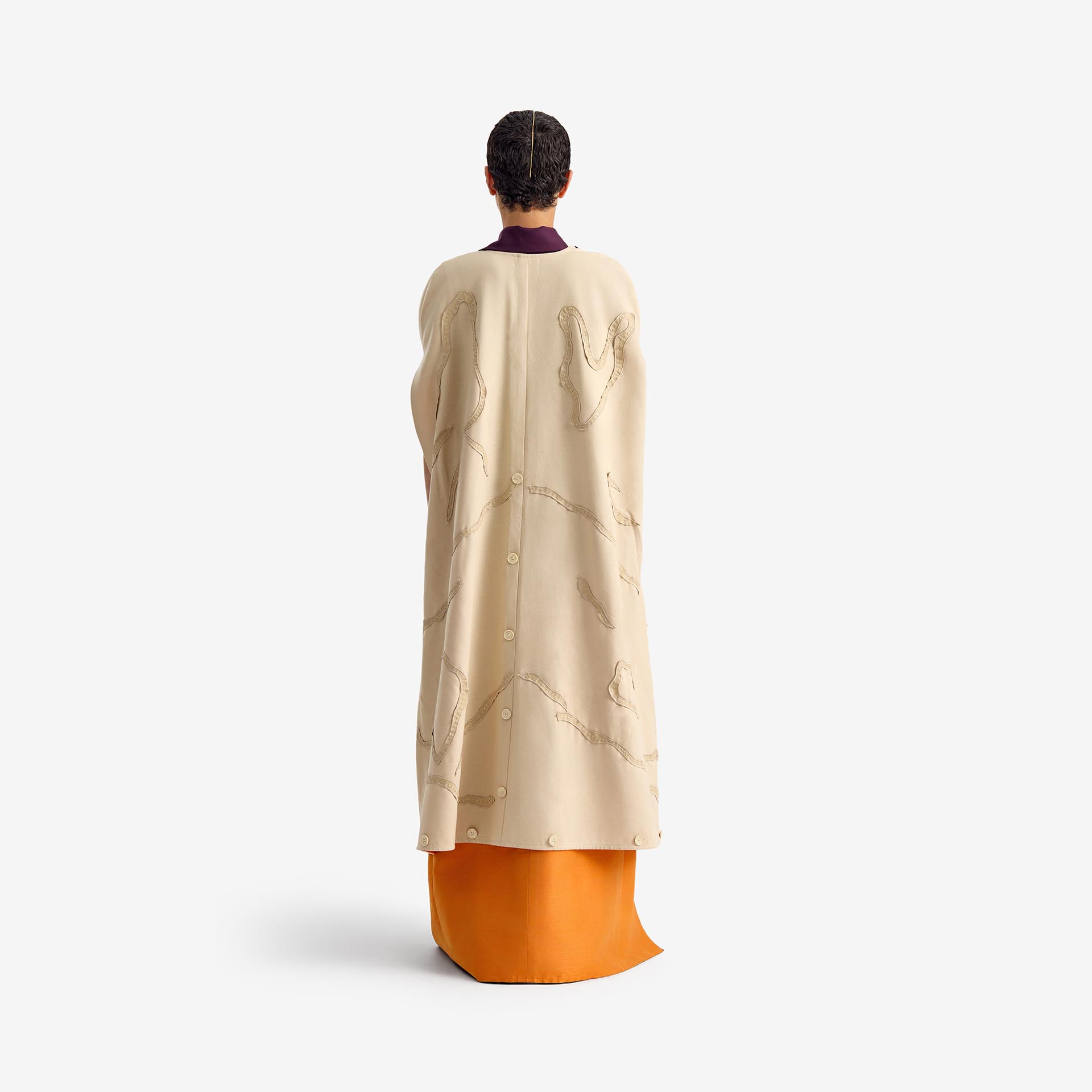 Caterpillar Kimono Jacket - This long orange linen kimono combines tradition and elegance with a lightweight, breathable fabric. Hand-embroidered details add an artisanal touch, making each piece unique.