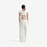 Caterpillar Top Off white - This fitted jacquard top makes a bold, architectural statement with oversized shoulder pads to accentuate the upper silhouette.