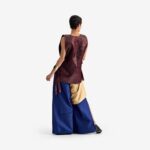 Silk Nest Top Dark burgundi - This jacquard top features a bold snake-skin-inspired texture, creating a high-fashion, distinctive look.