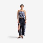 Silk Nest Top Mixed Pattern Denim - This bandeau top showcases a sleek, straight neckline and an asymmetrical silhouette, highlighted by one elongated side with decorative buttons for visual impact.