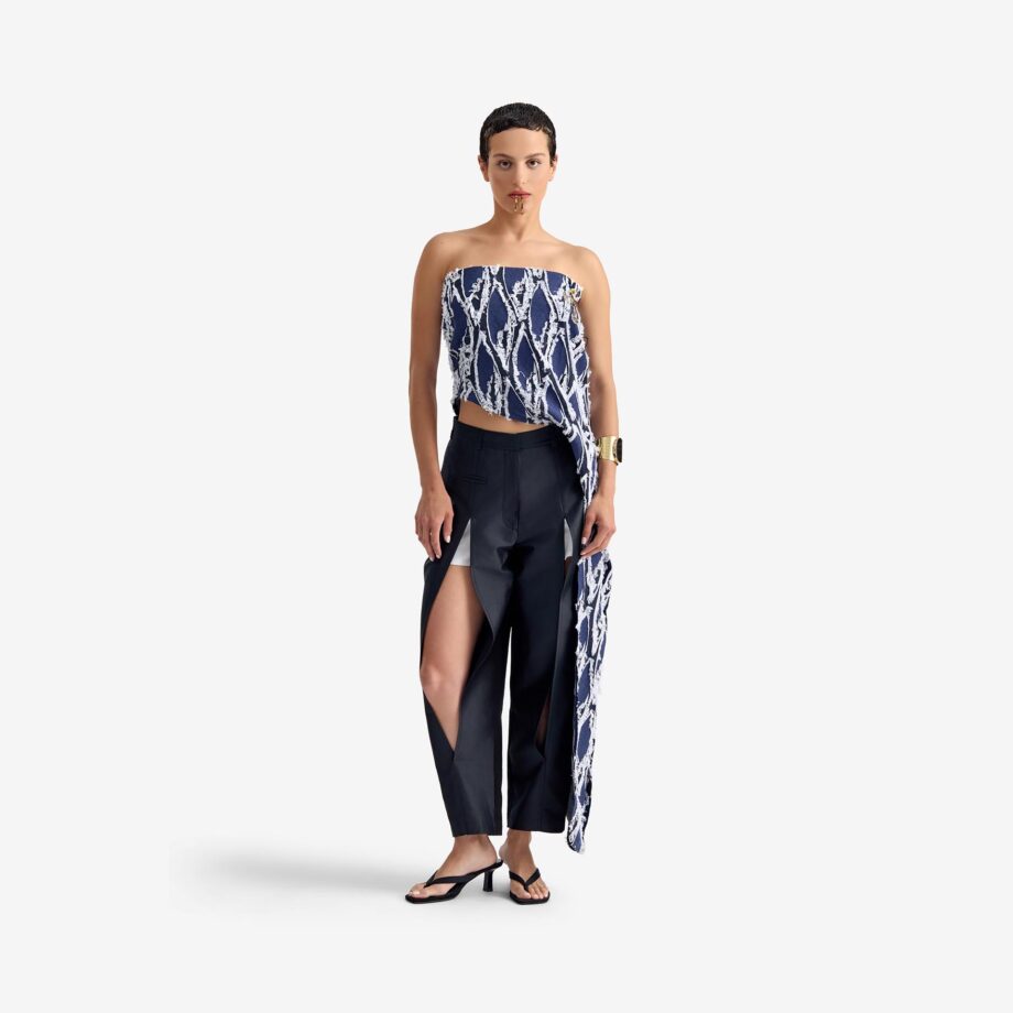 Silk Nest Top Mixed Pattern Denim - This bandeau top showcases a sleek, straight neckline and an asymmetrical silhouette, highlighted by one elongated side with decorative buttons for visual impact.