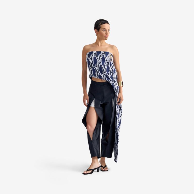 Silk Nest Top Mixed Pattern Denim - This bandeau top showcases a sleek, straight neckline and an asymmetrical silhouette, highlighted by one elongated side with decorative buttons for visual impact.