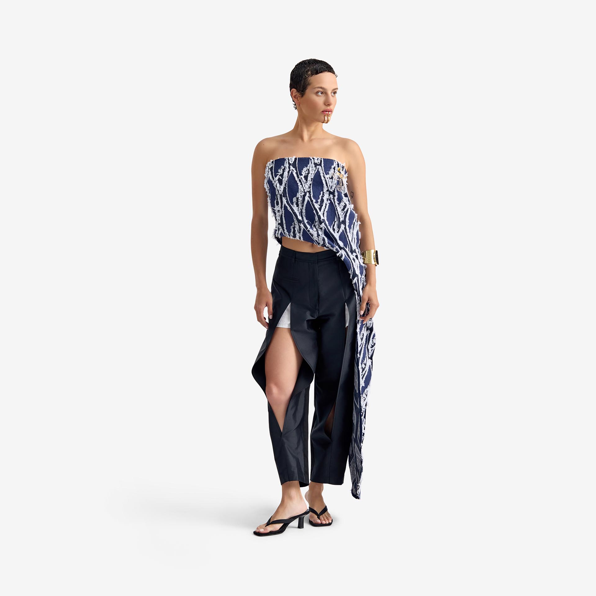 Silk Nest Top Mixed Pattern Denim - This bandeau top showcases a sleek, straight neckline and an asymmetrical silhouette, highlighted by one elongated side with decorative buttons for visual impact.