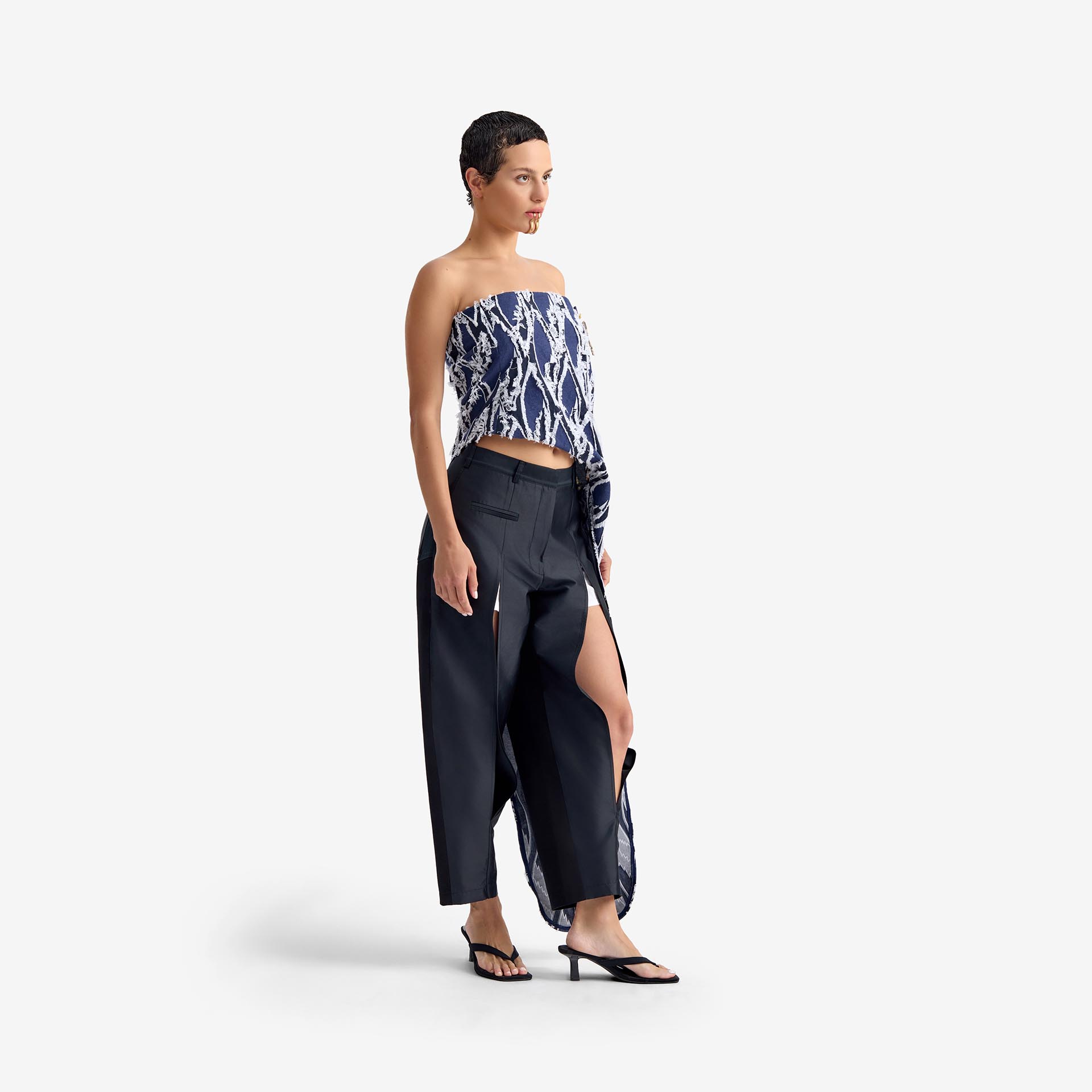 Silk Nest Top Mixed Pattern Denim - This bandeau top showcases a sleek, straight neckline and an asymmetrical silhouette, highlighted by one elongated side with decorative buttons for visual impact.